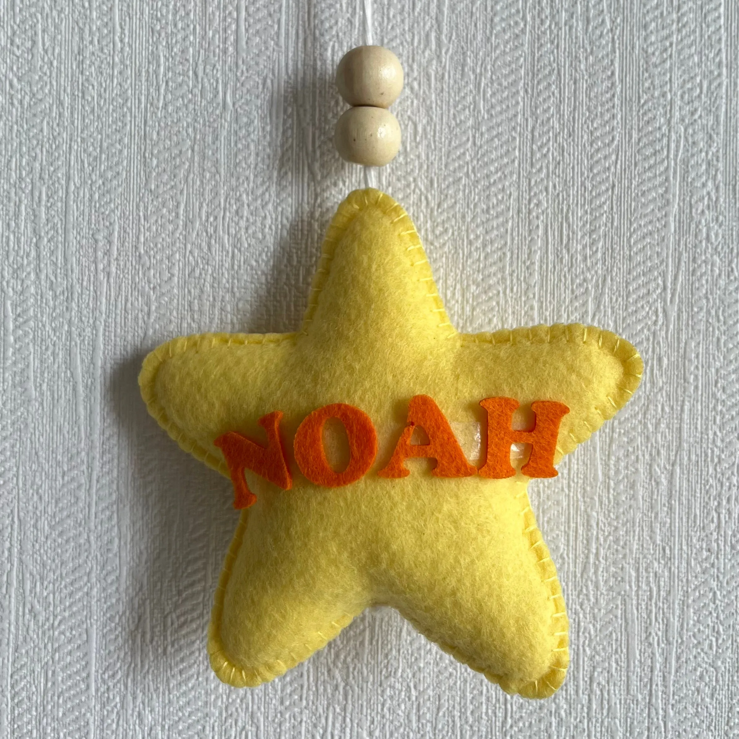 Baby Ellie on a Moon Name Hanging